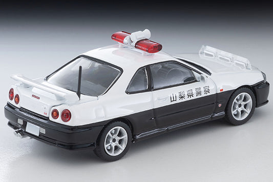 Tomica Limited Vintage Nissan Skyline ER34 25GT Turbo 2-door police car with GT-R badge and patrol equipment.