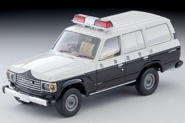 Tomica Limited Vintage Toyota Land Cruiser 60 Hokkaido Police patrol car with round headlights, red light and covered side windows.