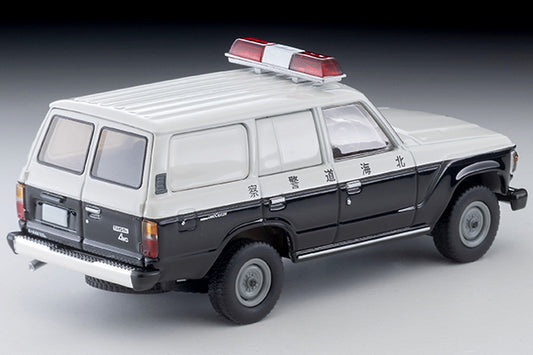 Tomica Limited Vintage Toyota Land Cruiser 60 Hokkaido Police patrol car with round headlights, red light and covered side windows.