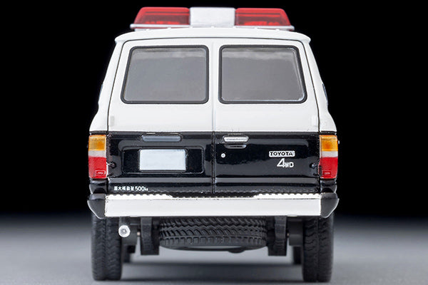 Tomica Limited Vintage Toyota Land Cruiser 60 Hokkaido Police patrol car with round headlights, red light and covered side windows.