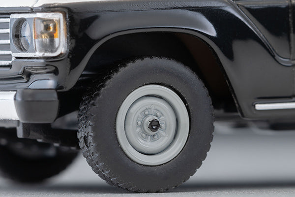Tomica Limited Vintage Toyota Land Cruiser 60 Hokkaido Police patrol car with round headlights, red light and covered side windows.