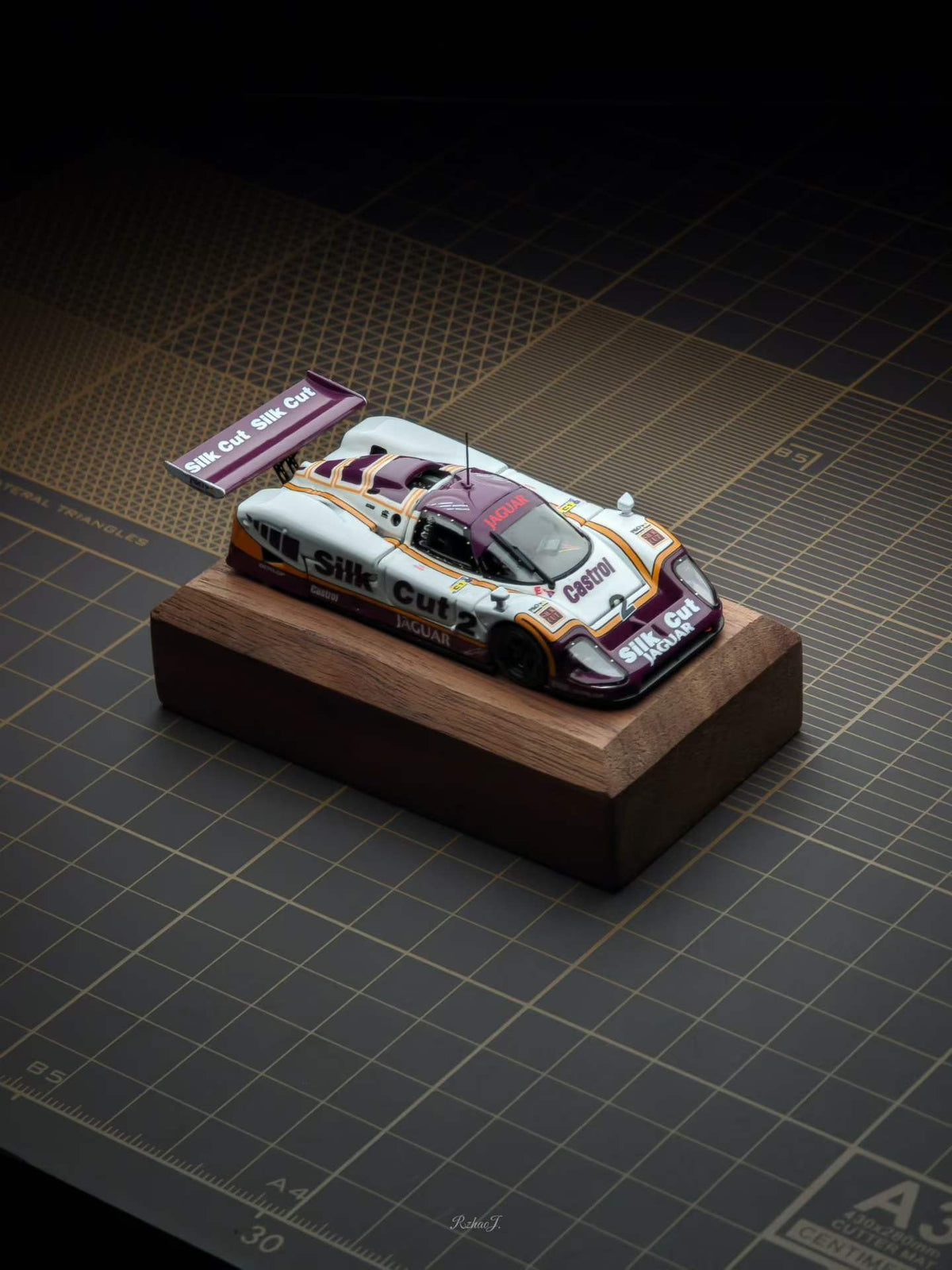 Transcend 1:64 Jaguar XJR-9 Le Mans Group C race car with magnetic front and rear covers showing detailed interior.