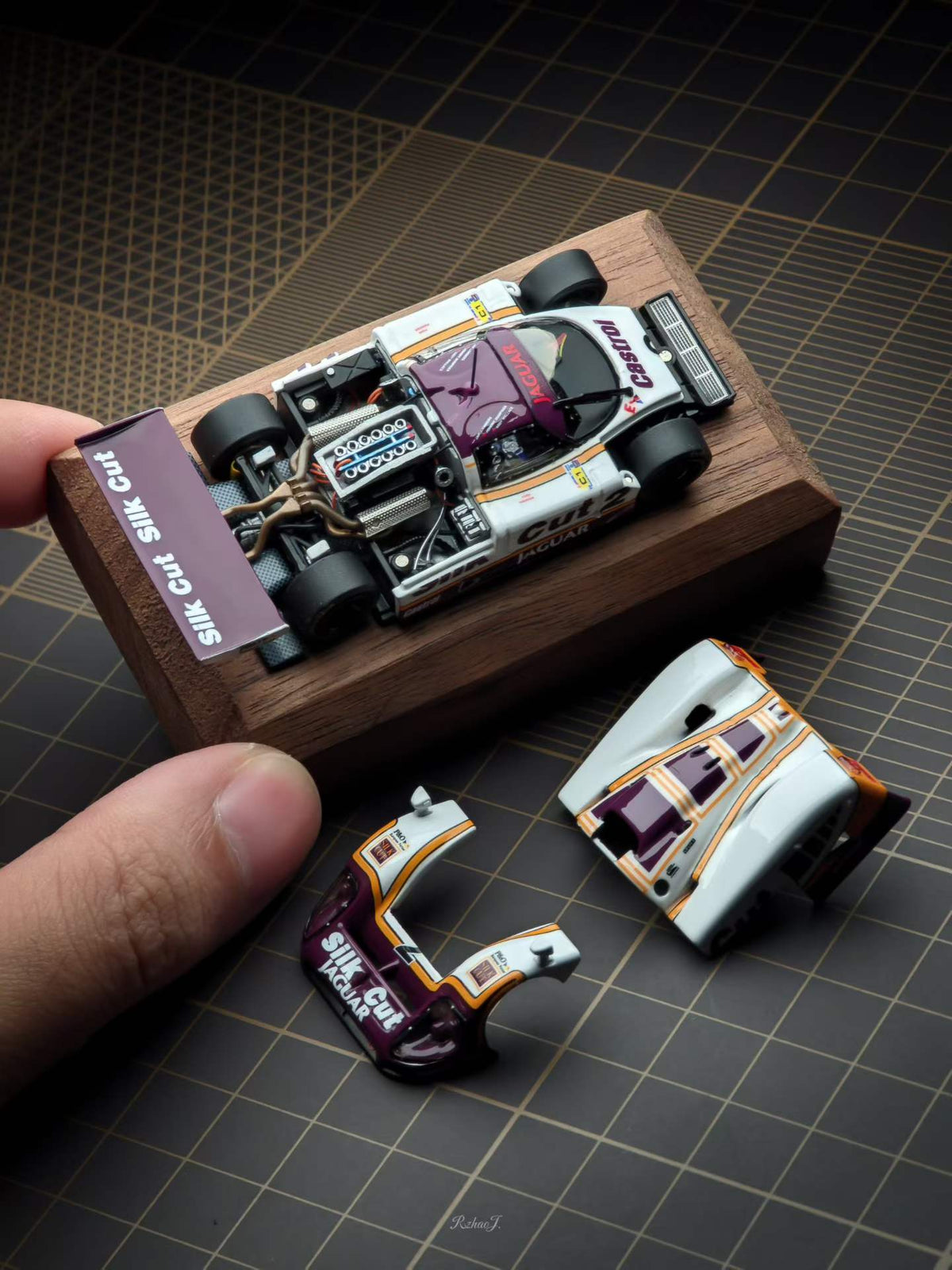 Transcend 1:64 Jaguar XJR-9 Le Mans Group C race car with magnetic front and rear covers showing detailed interior.