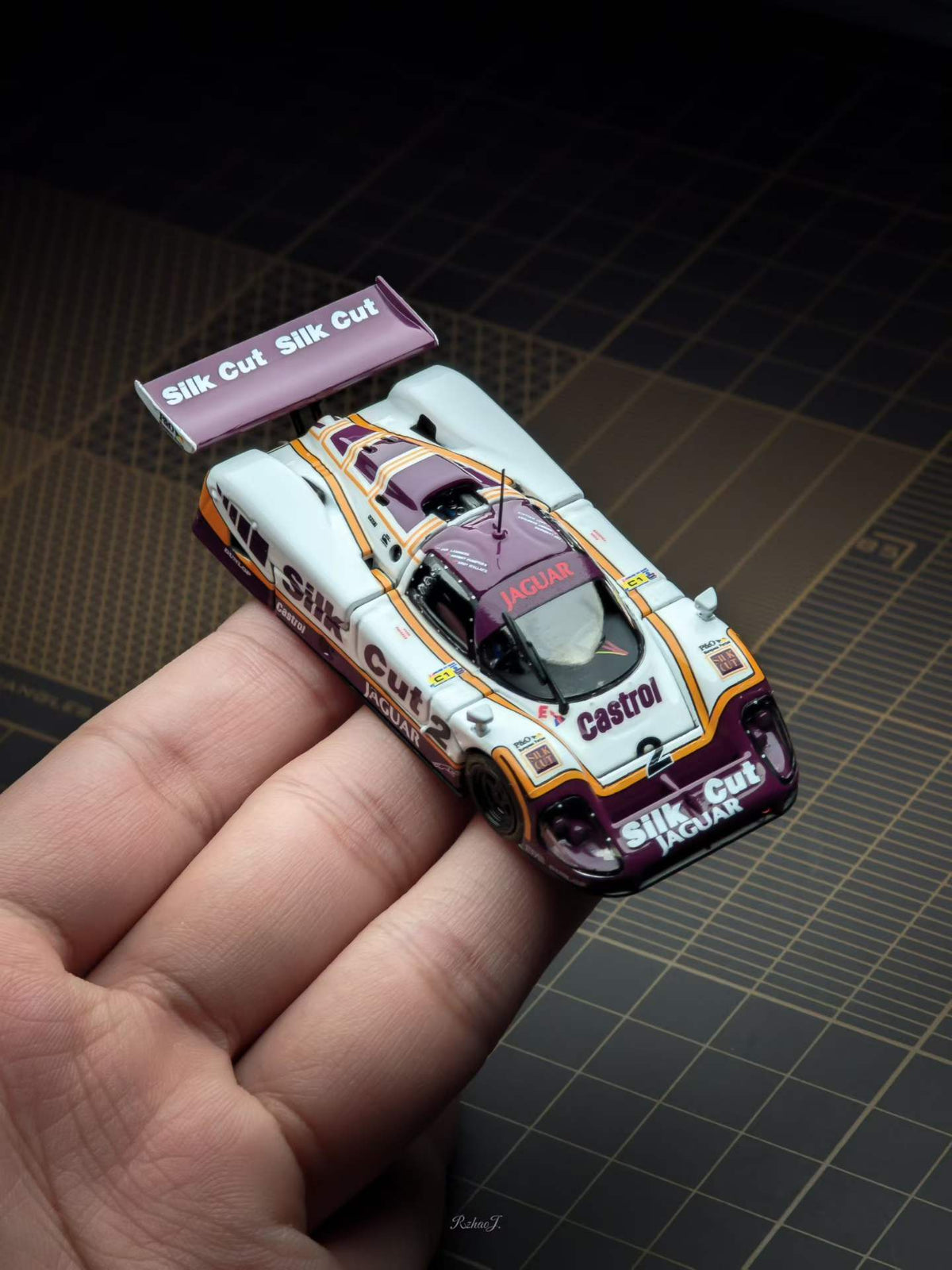 Transcend 1:64 Jaguar XJR-9 Le Mans Group C race car with magnetic front and rear covers showing detailed interior.