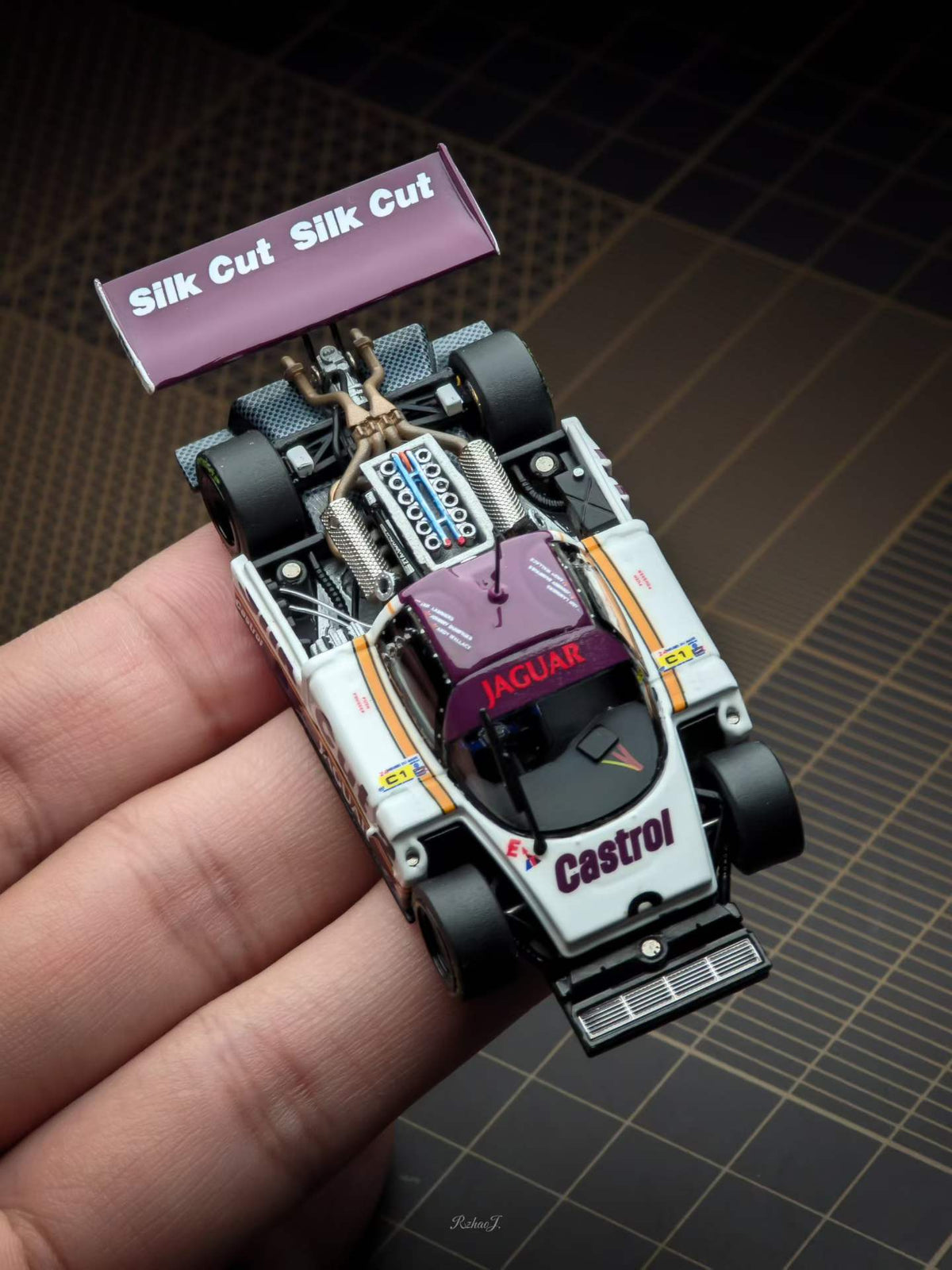 Transcend 1:64 Jaguar XJR-9 Le Mans Group C race car with magnetic front and rear covers showing detailed interior.