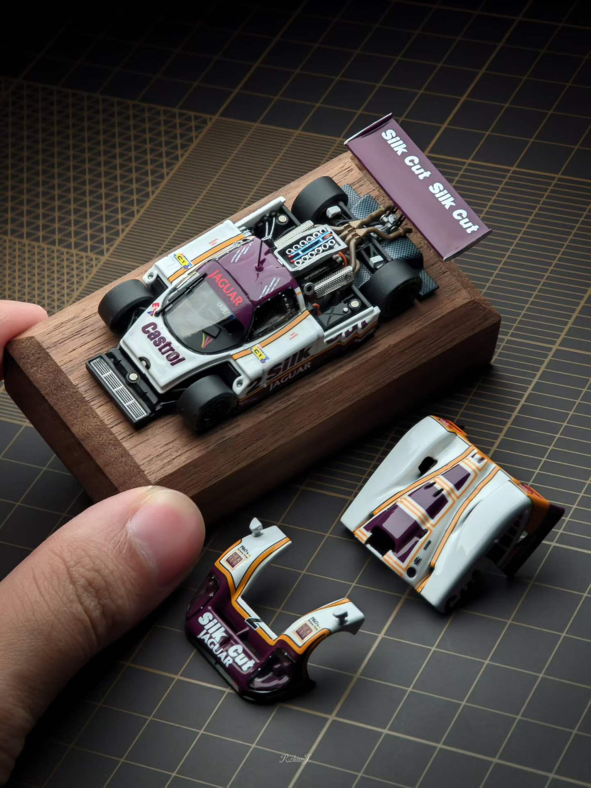 Transcend 1:64 Jaguar XJR-9 Le Mans Group C race car with magnetic front and rear covers showing detailed interior.