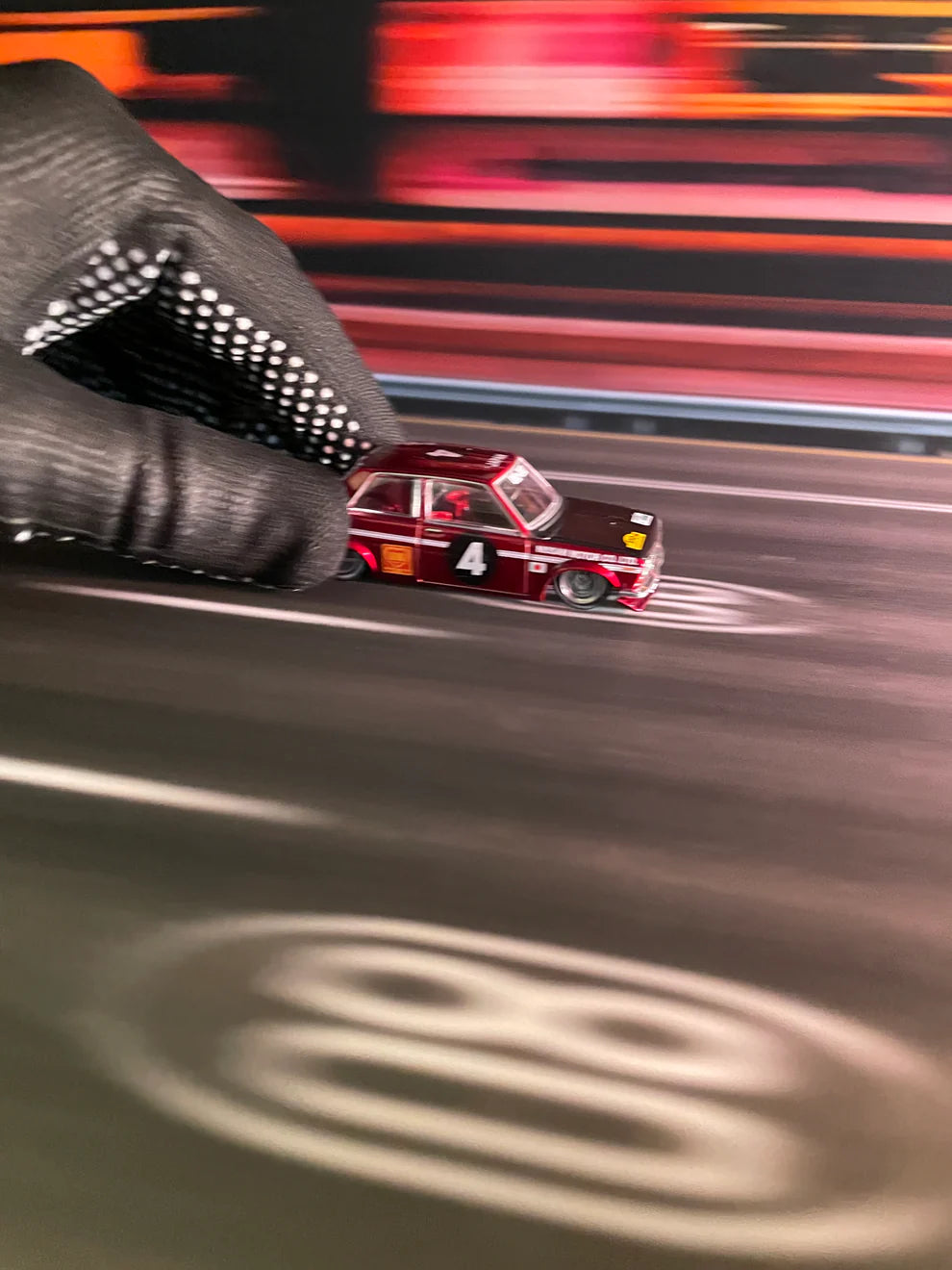 TurboPads Blur City Background 70x17.5cm mat featuring a blurred urban skyline for 1:64 diecast car displays. with cars