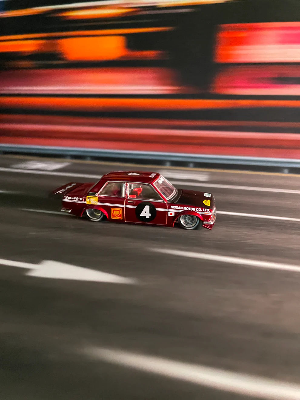 TurboPads Blur City Background 70x17.5cm mat featuring a blurred urban skyline for 1:64 diecast car displays. with cars